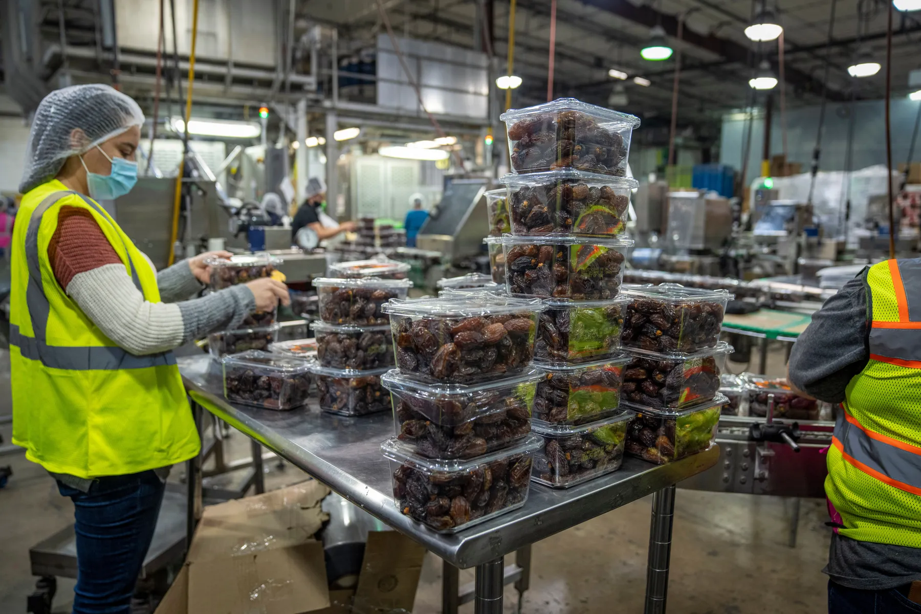 Production staff handling and packing products